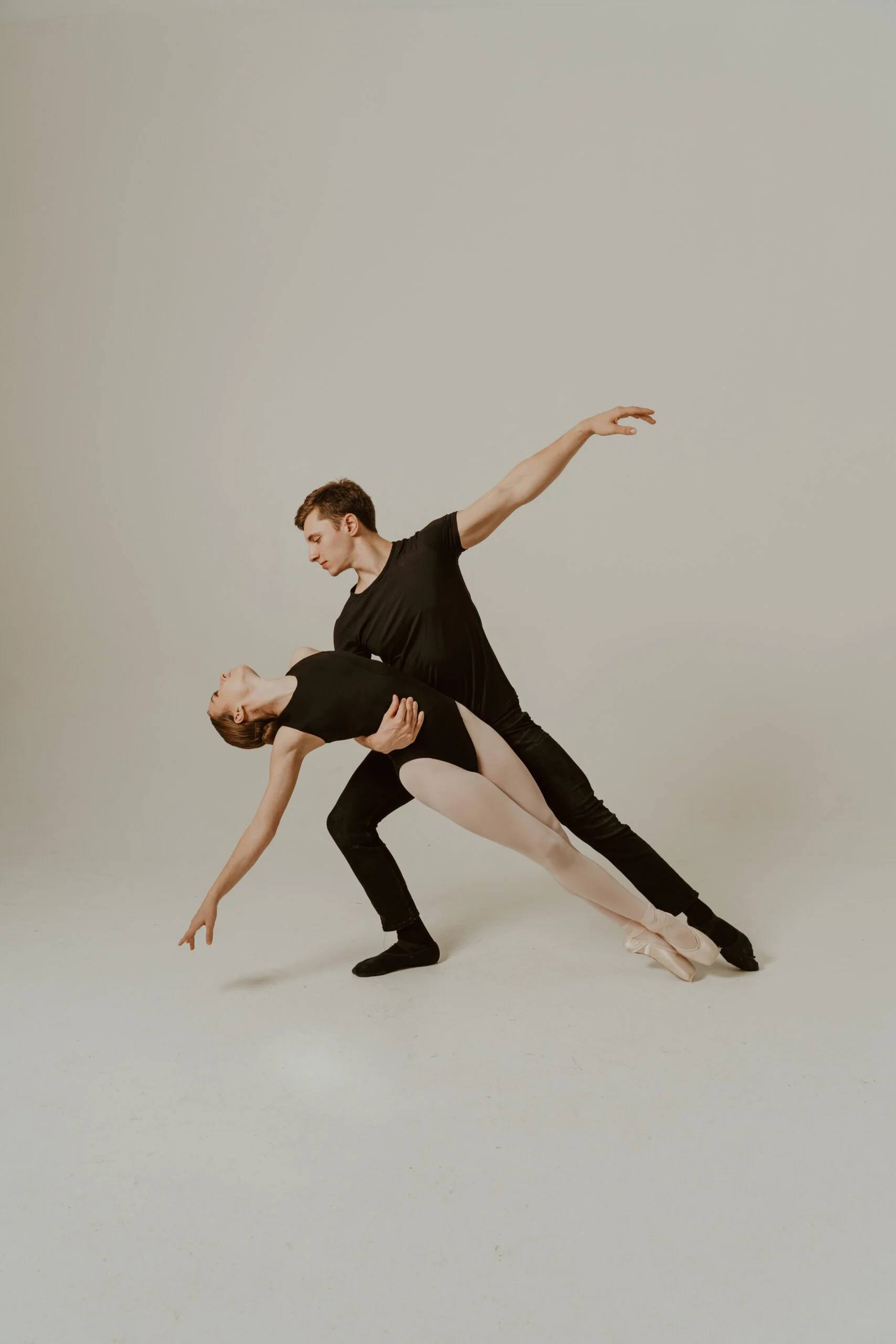 Two Dancers in front of black background for branding photography session
