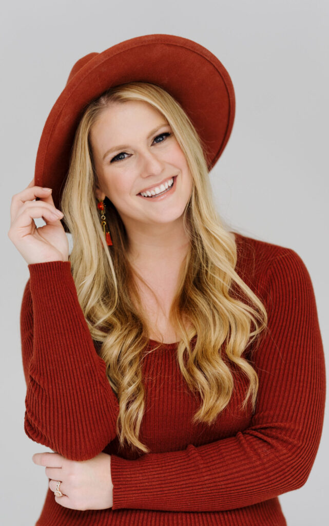 Glen Allen Elopement Photographer Stephanie Jenkins Photo posing for portrait in red hat and shirt