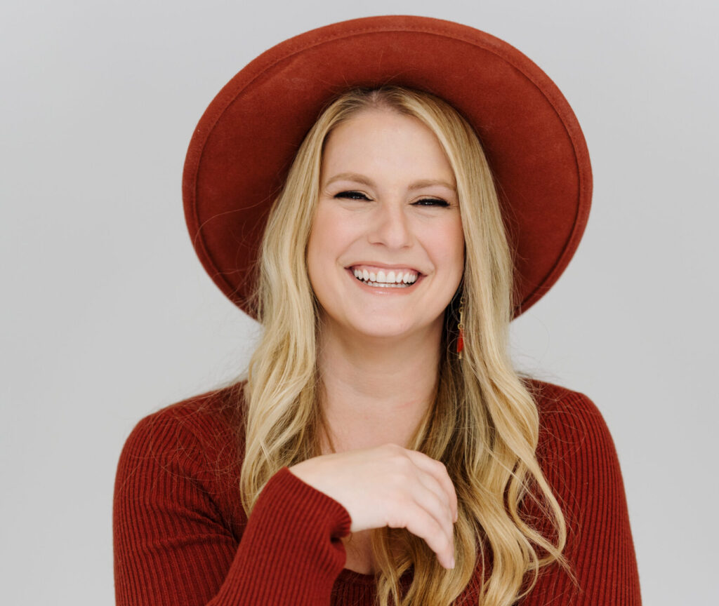 Glen Allen Headshot Photographer stephanie jenkins photo posing for portrait in red shirt and hat